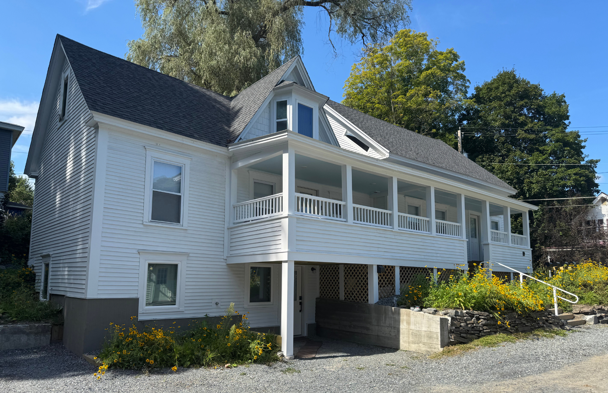 Side view of a white home in Bradford improved by VHIP